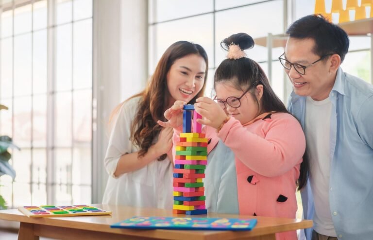 Child with Down syndrome supported by parents in occupational therapy activity in Darwin NT.